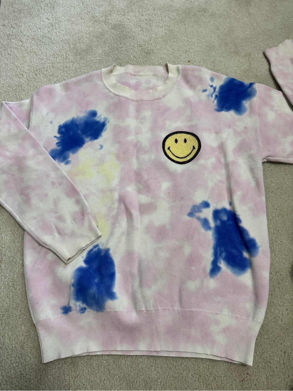 Maje Pink Tie-Dye Crewneck Sweater with Blue Accents and Yellow Smiley